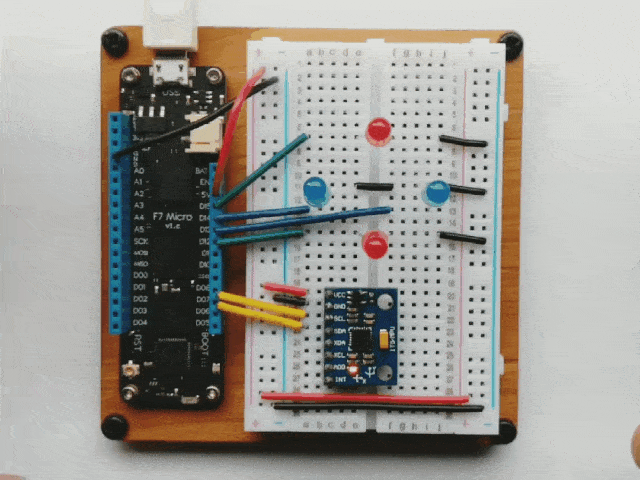 Video of a Meadow board connected to a breadboard with a gyroscopic sensor that controls four LEDs, based on how the board is tilted.