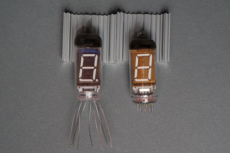 An IV-11 VFD tube from 1989 on the left and an IV-12 VFD tube from 1992 on the right.