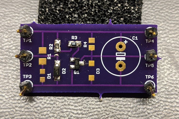 Open-drain, active-low power good to open-drain, active-low converter disable test board. Rated for 60 V operation.