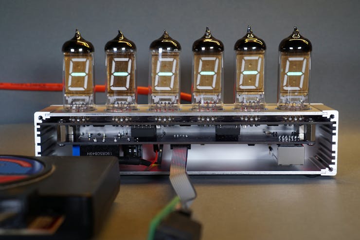 Internal view of the clock with the debugger and serial console cable still connected.
