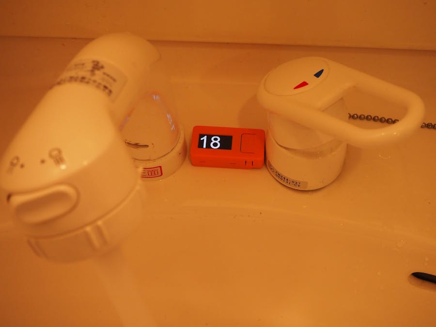 Hand washing timer with water sound detector