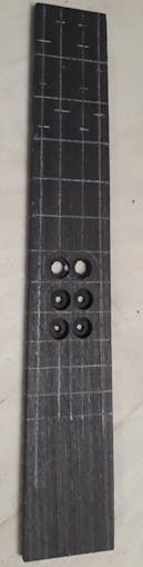 Fretboard, rear side, w/ marked positions for LEDs and 4 nicely and 2 badly driled dimples.