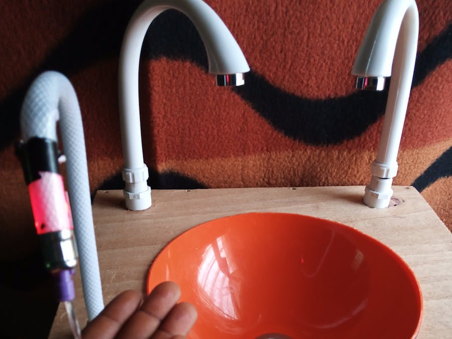 Handsfree hand washing and sanitizing system