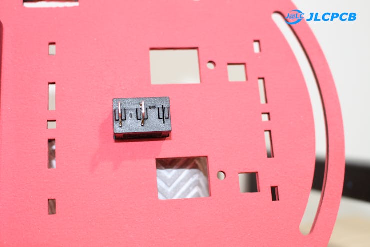 Figure 4C - Top view of base piece with button attached.