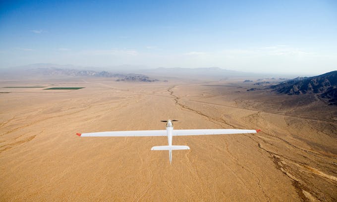 Mockup of fire-detecting plane flying over a desert