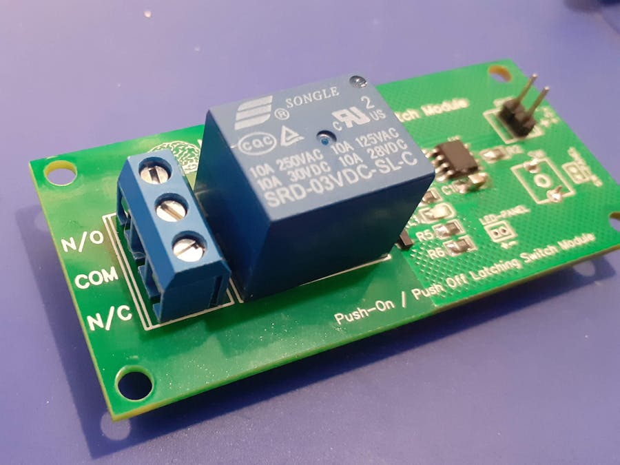 555 based latching switch module