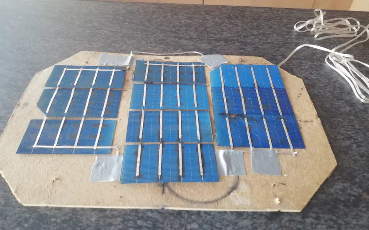 The very first assembly of solar cells in series to output 5V DC