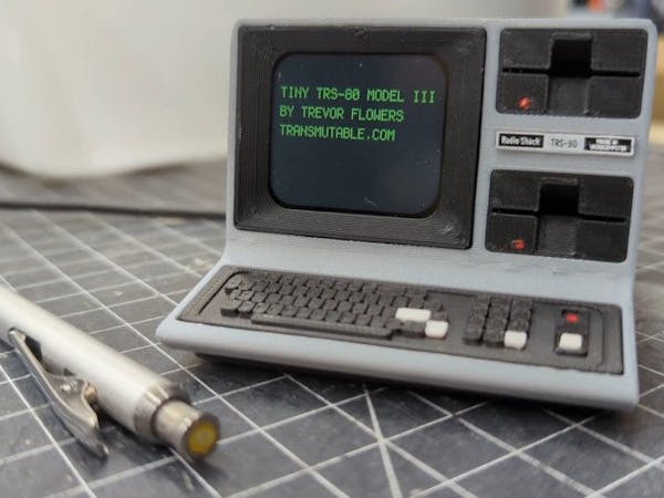 Read more about the article Trevor Flowers’ Miniature TRS-80 Microcomputer Homes an Adafruit QT Py for a Working Show