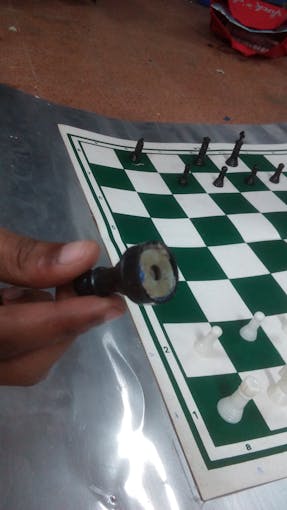 Chess coin with metal base.