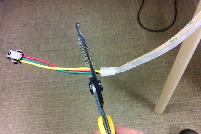 Cut the harness from the LED strip end section you cut off earlier.