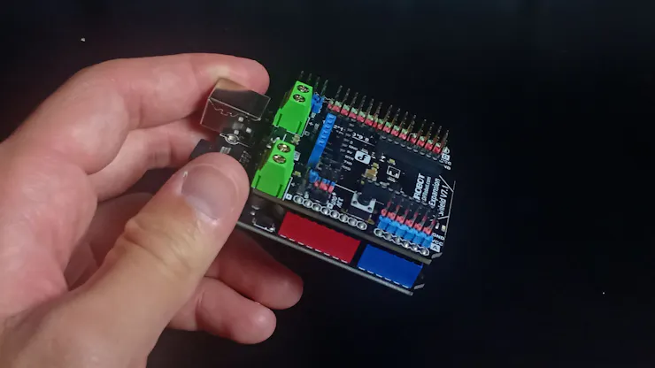 Attach the I/O expansion shield on the Arduino board