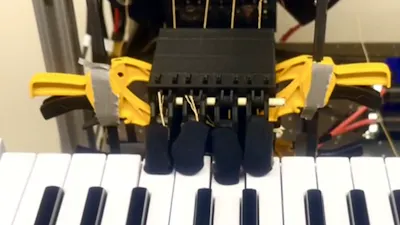 The Musician Hand Is a Robotic That Learns Piano by "Ear" 1
