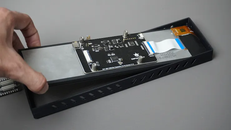 ESP32-P4 display assembly inside housing
