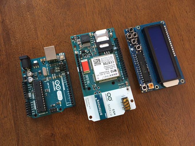 Arduino Uno, GSM shield, and LCD shield