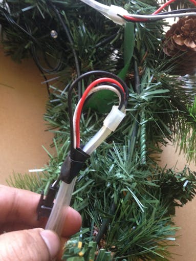 using electrical tape at the other end of Neopixel strip to avoid shorting of the wires
