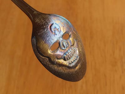 Skull spoon. (clown face)