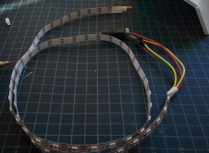 On this LED strip, the ground wire is colored yellow instead of the customary black. It is marked where the wire attaches to the strip.