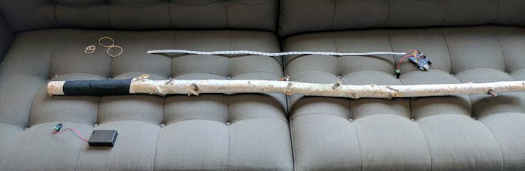 A stick, sports tape, a few rubber bands, and the electronics.
