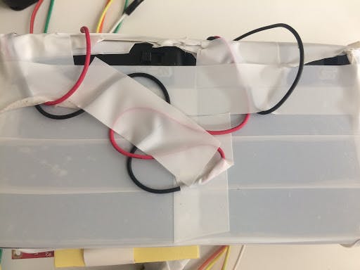 Wires of the two boxes tied and taped together.