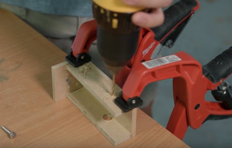 Drill two holes on the other side of the lower housing above where the Pi will sit with a 5/16" drill bit