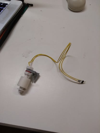 The water level switch, with a resistor and header pins connected