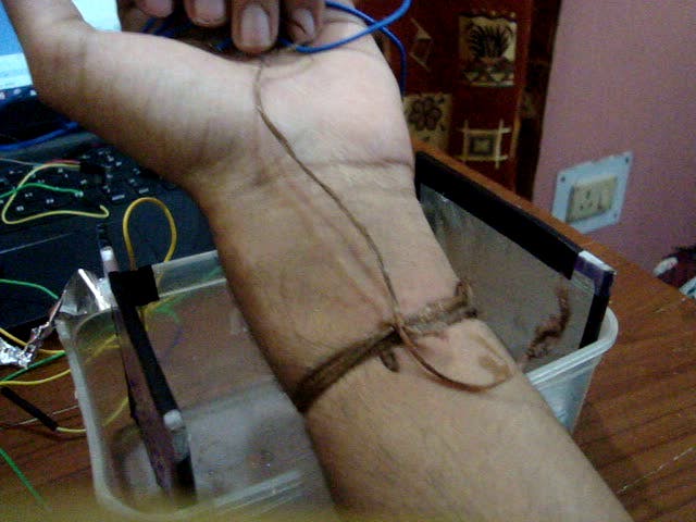 bare copper wire tied to left wrist