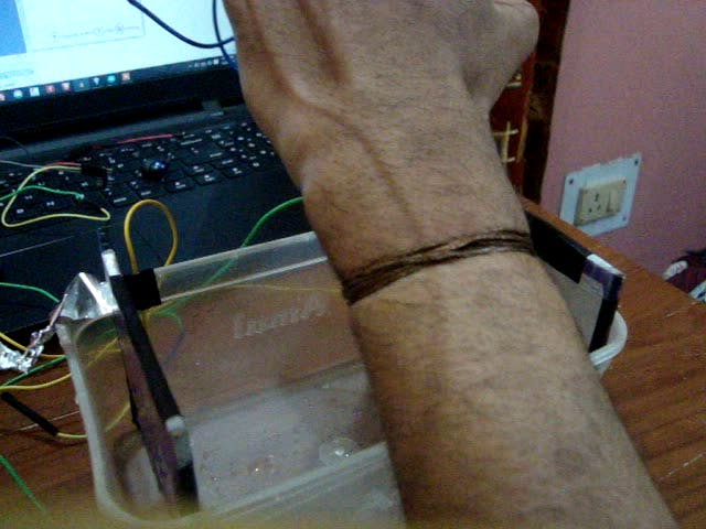 bare copper wire tied to left wrist