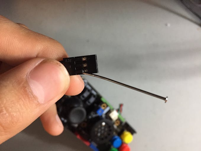 Lifting the Header Tab to Remove Power and Data Wires