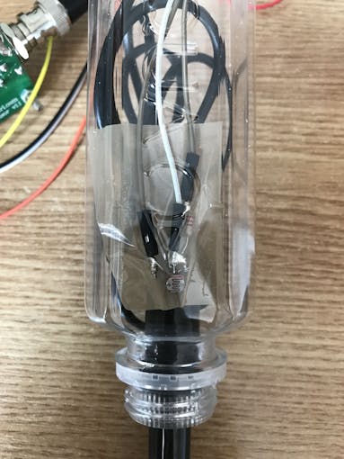 Tape the photoresistor close to the bottle's hole