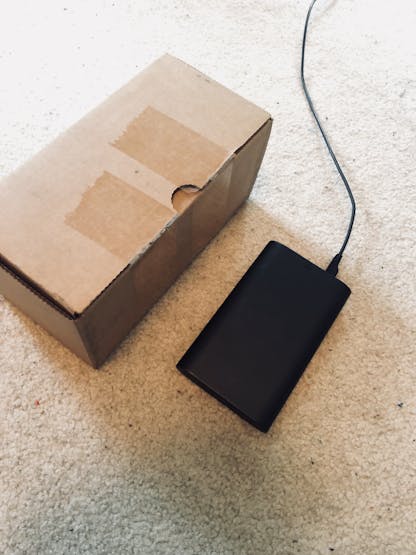 Depicts the Walabot placed on the floor in front of a 10cm tall box.