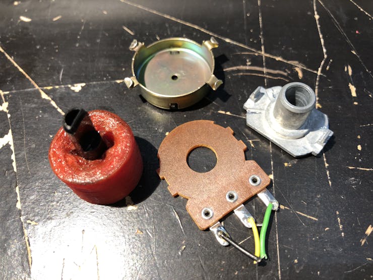 Salvaged the black D-shaft from a potentiometer