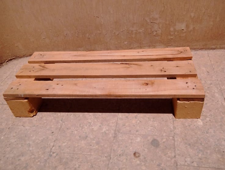 Add 4 cubes to the buttom , place 2 ( 30 cm ) on the cubes and place 3 ( 70 cm ) bars on the top of small wood bars then use bolts and hammer to fix them.