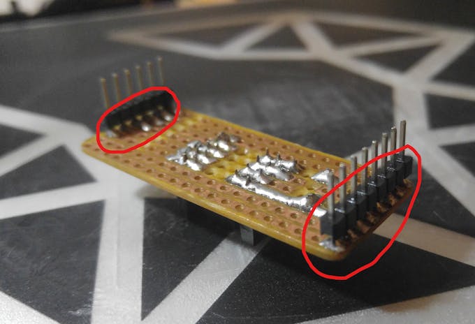 Pins soldered from underneath instead of on top.