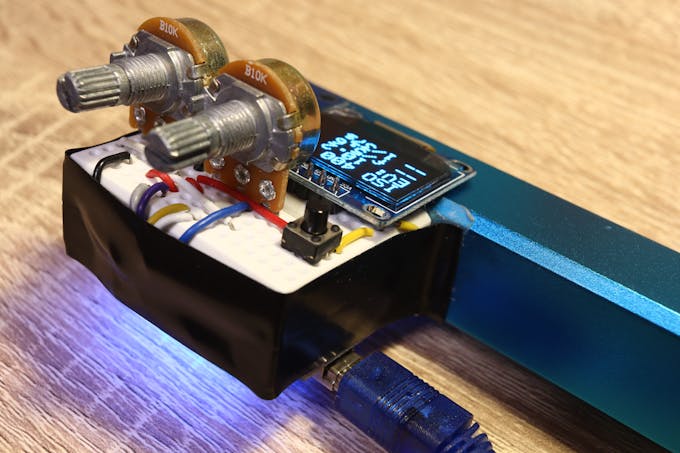 Use the two potentiometers to adjust aperture and ISO; shutter speed is calculated automatically