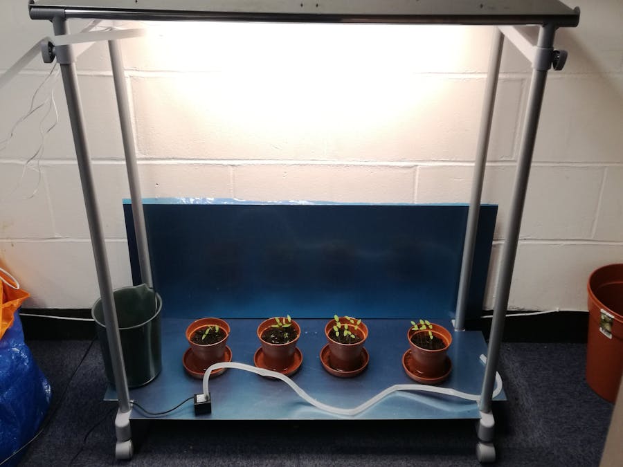 Watering, lighting and monitoring system for plant growth