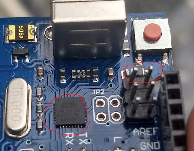 The Arduino chip and the two 'clear firmware' pins