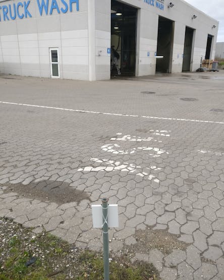 Reflector panel across from the corner of the building where the setup is mounted. It's roughly 15m across.