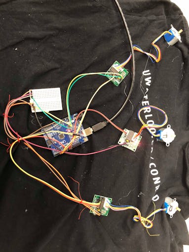 Shirt with embedded vibrators (through Stepper Motors) that provide haptic clues on direction and distance of obstruction.