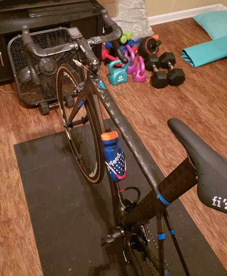 An example of a stationary bicycle with a fan placed in front of it.