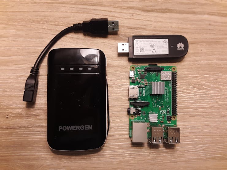 Raspberry Pi, 3G USB modem with Soracom Global SIM, and external battery