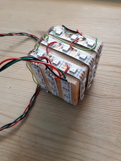 Wooden block wrapped in LED strips
