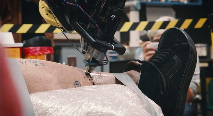 Watch an Industrial Robot Arm Give a Man a Tattoo 