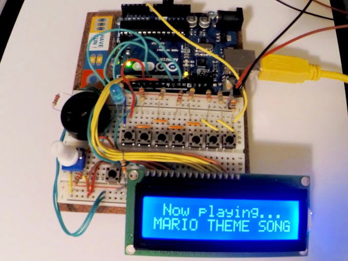 Push any piano key to play a song shown on the menu. The LCD will show the current song title.