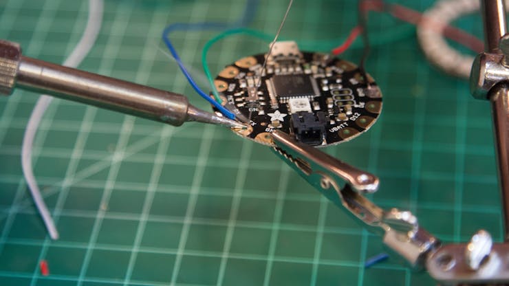 Connect the fourth and final wire to the TX Pad.