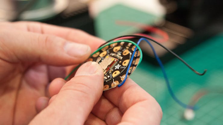 Place the Bluefruit module on the back of the Flora and line up the wires (see Wiring Diagram in the Schematics section).