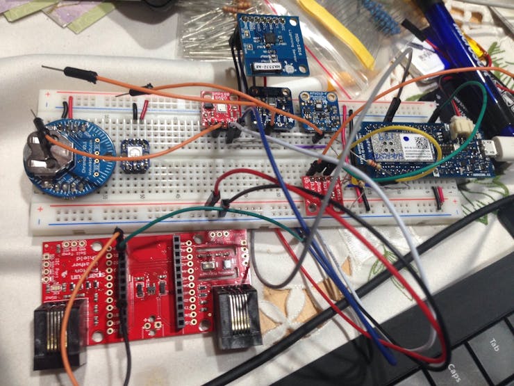 My sensor deck, on a breadboard, with the Photon Weather Shield and assorted sensors.