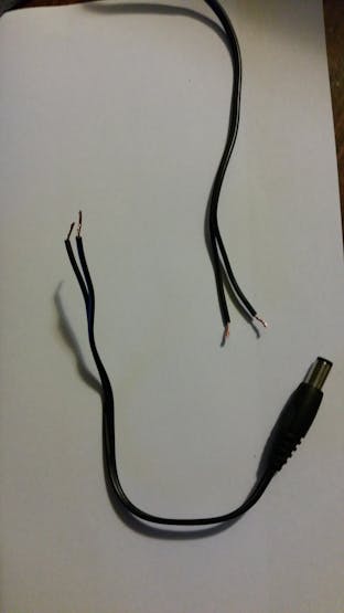 Cut the wires between the wall-wart and DC-jack (which plugs into router). Mark one of pair with tape.