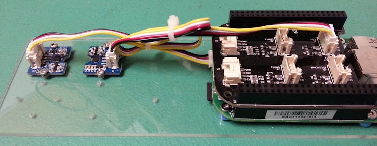 The compass (second from left) connected to the Grove Cape (i2c-1) connector.