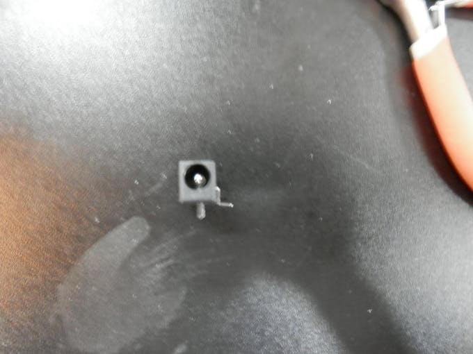 Open end view of 2.1mm Barrel Jack with bent over middle pin