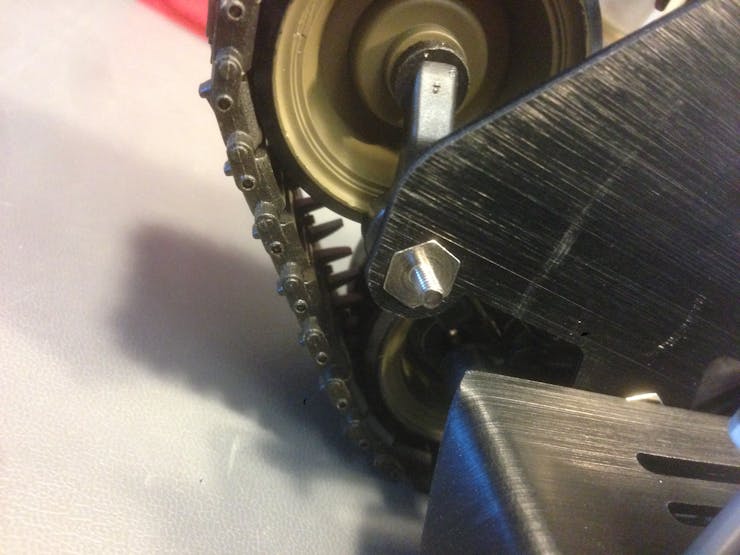 Before you screw in the bolt, sand (or grind) the hole to remove machining debris.